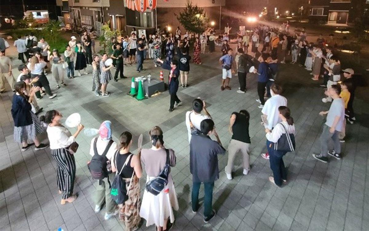 Students dancing Bon dance in a circle